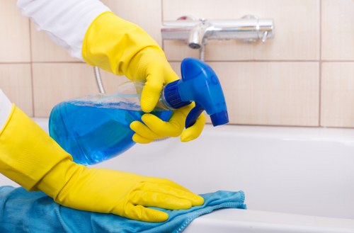 Trained Belgravia carpet cleaning operative using protective equipment on site